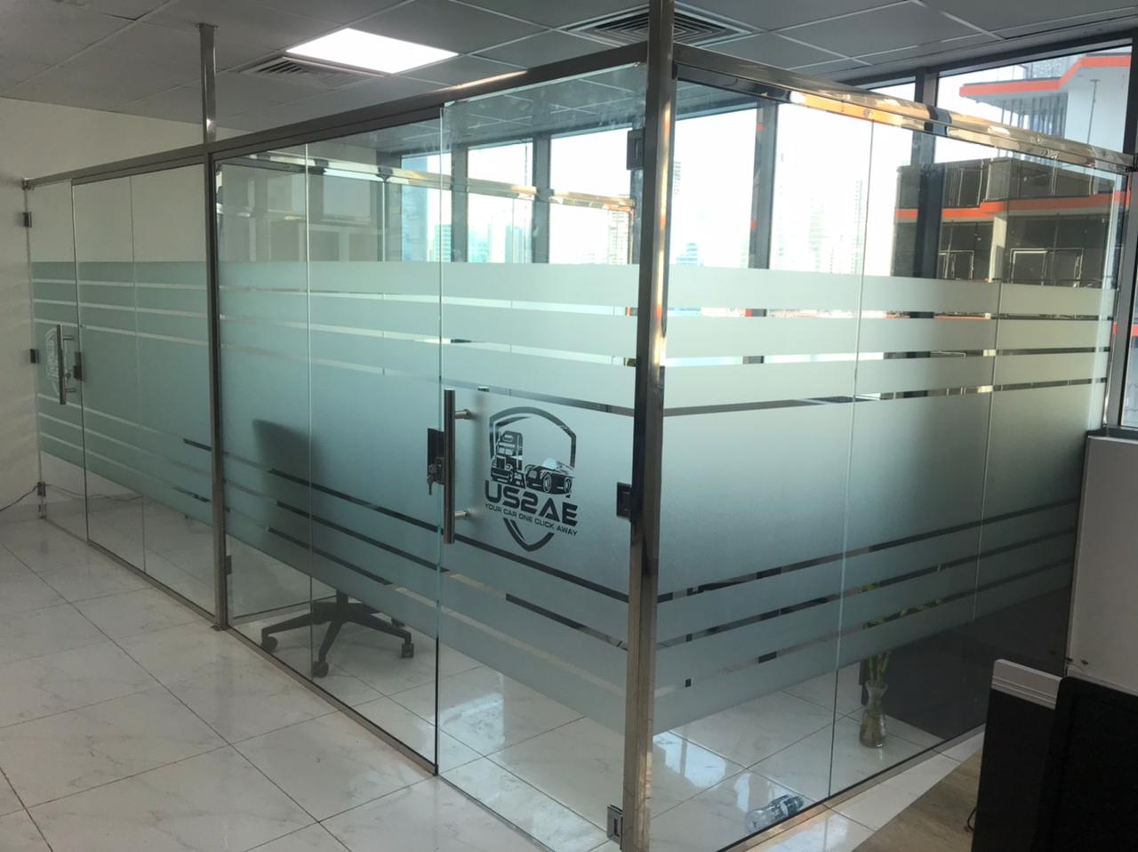 Custom glass office partition with aluminium framing installed in Dubai commercial space