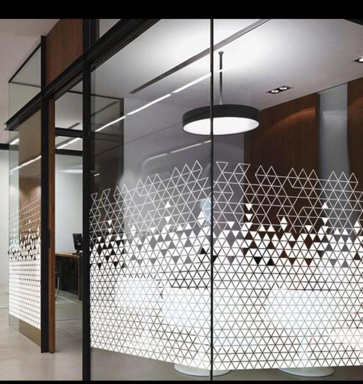 Frameless glass partition installation for modern office interior in Dubai